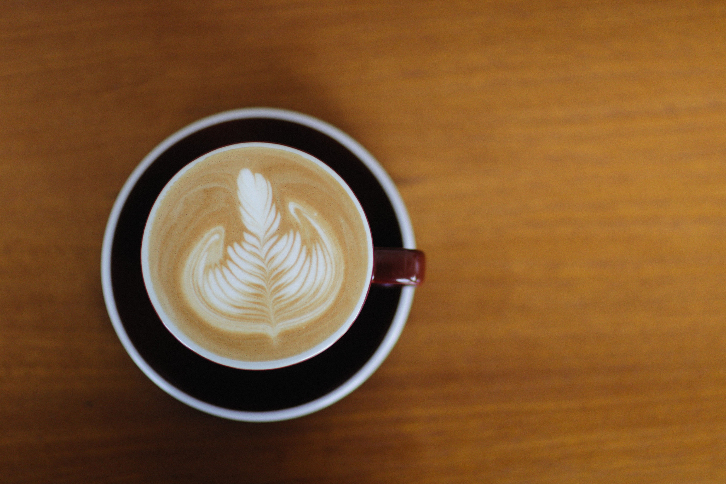 Cappuccino with latte art seen from above